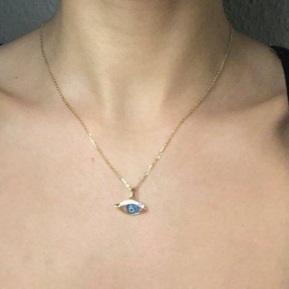 Μάτι χρυσό δύο όψεων με πέτρες